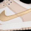 DUNK LOW GOLD SWOOSH PHANTOM_METALLIC GOLD_SANDDRIFT_SAIL