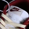 DUNK LOW SB PREMIUM WHITE_TEAM RED_COCONUT MILK