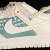 DUNK LOW SB ESS COCONUT MILK_WHITE_SAIL